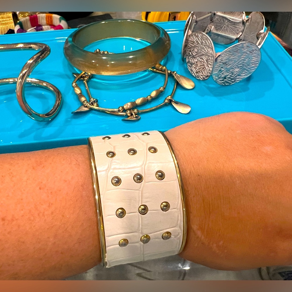 Lot of white, gold and silver bracelets and bangles!